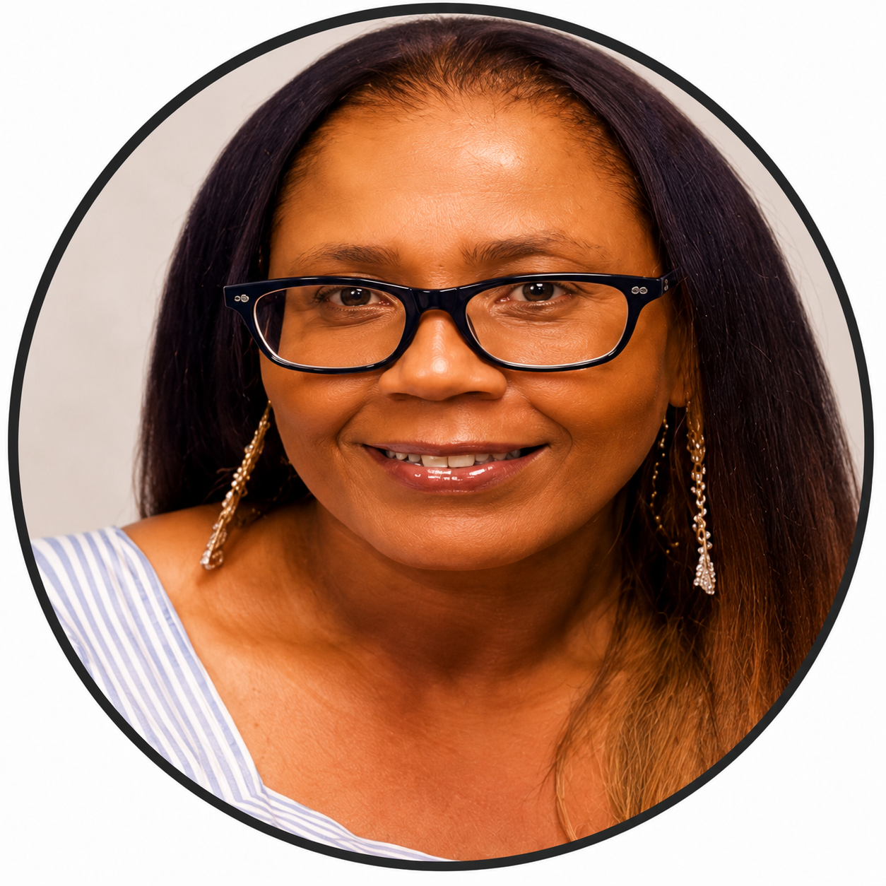 Smiling woman wearing glasses and earrings