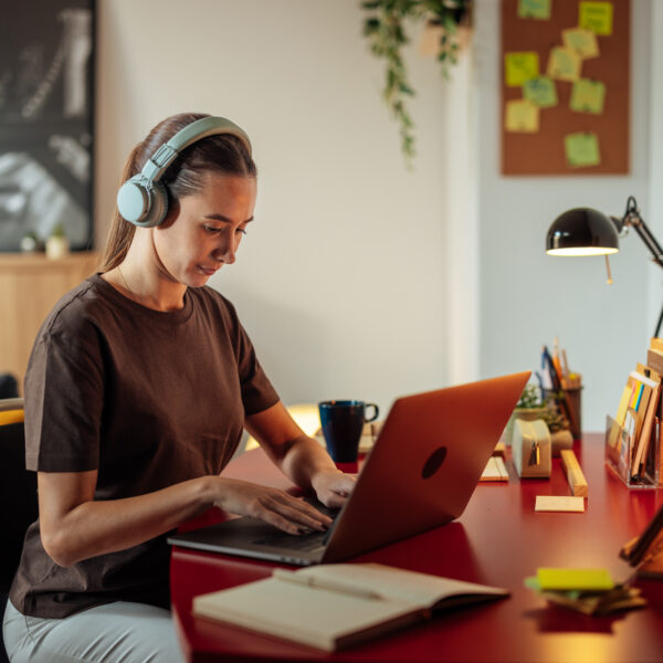 Focused person typing at computer