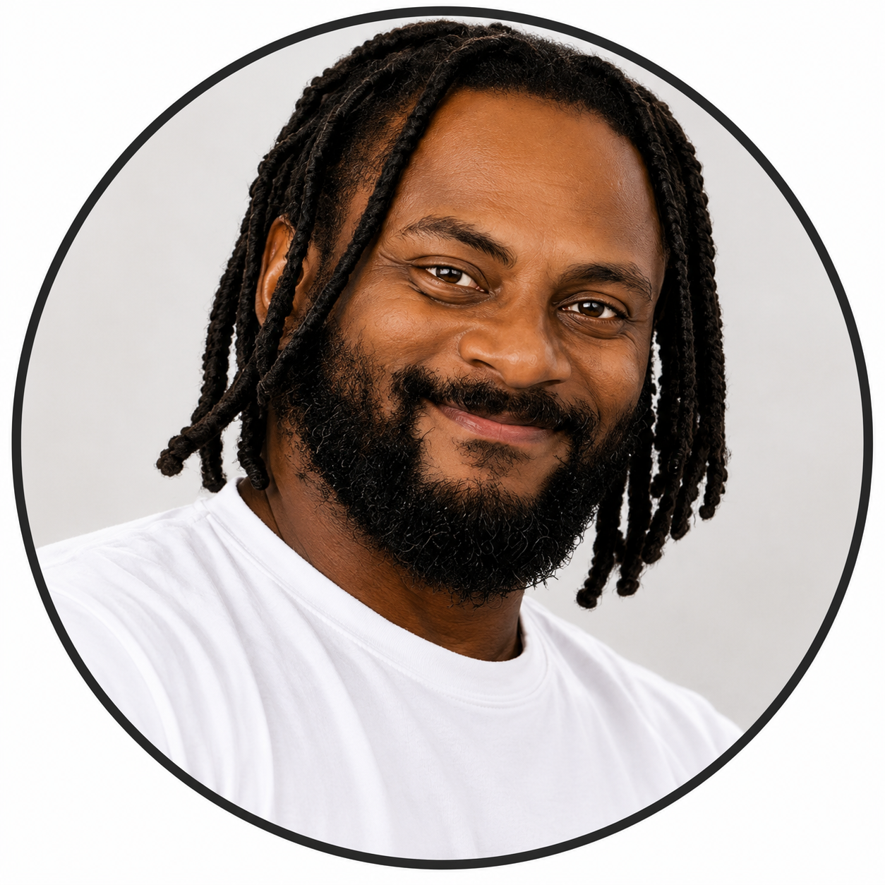 Smiling man with dreadlocks and beard