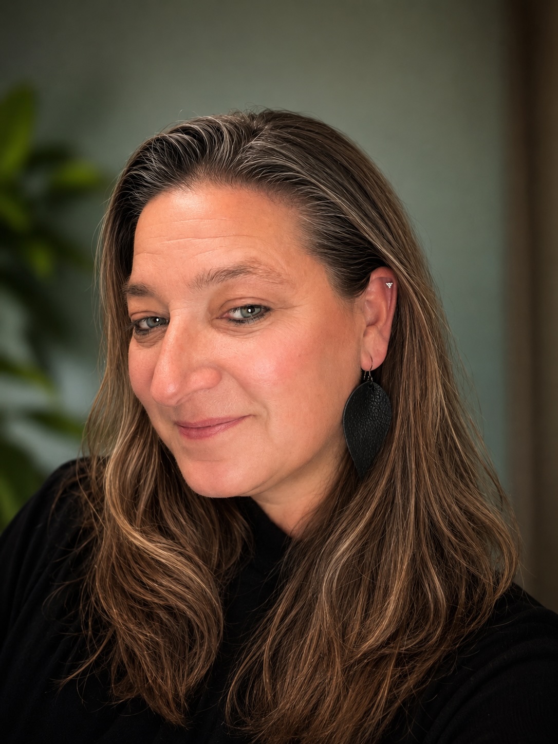 Portrait of smiling woman with long brown hair